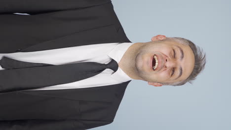 Vertical-video-of-Businessman-winking-at-camera.
